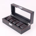 Collector's watch box with carbon-fiber-textured finish and individual padded slots