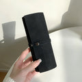 Five-slot PU strap organizer roll shown in black
