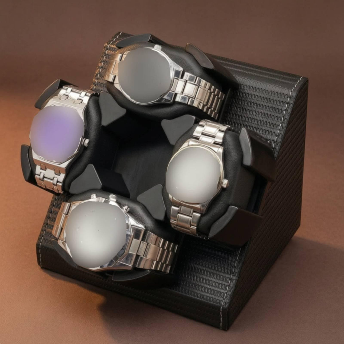 Four-watch automatic winder in black textured finish holding four watches